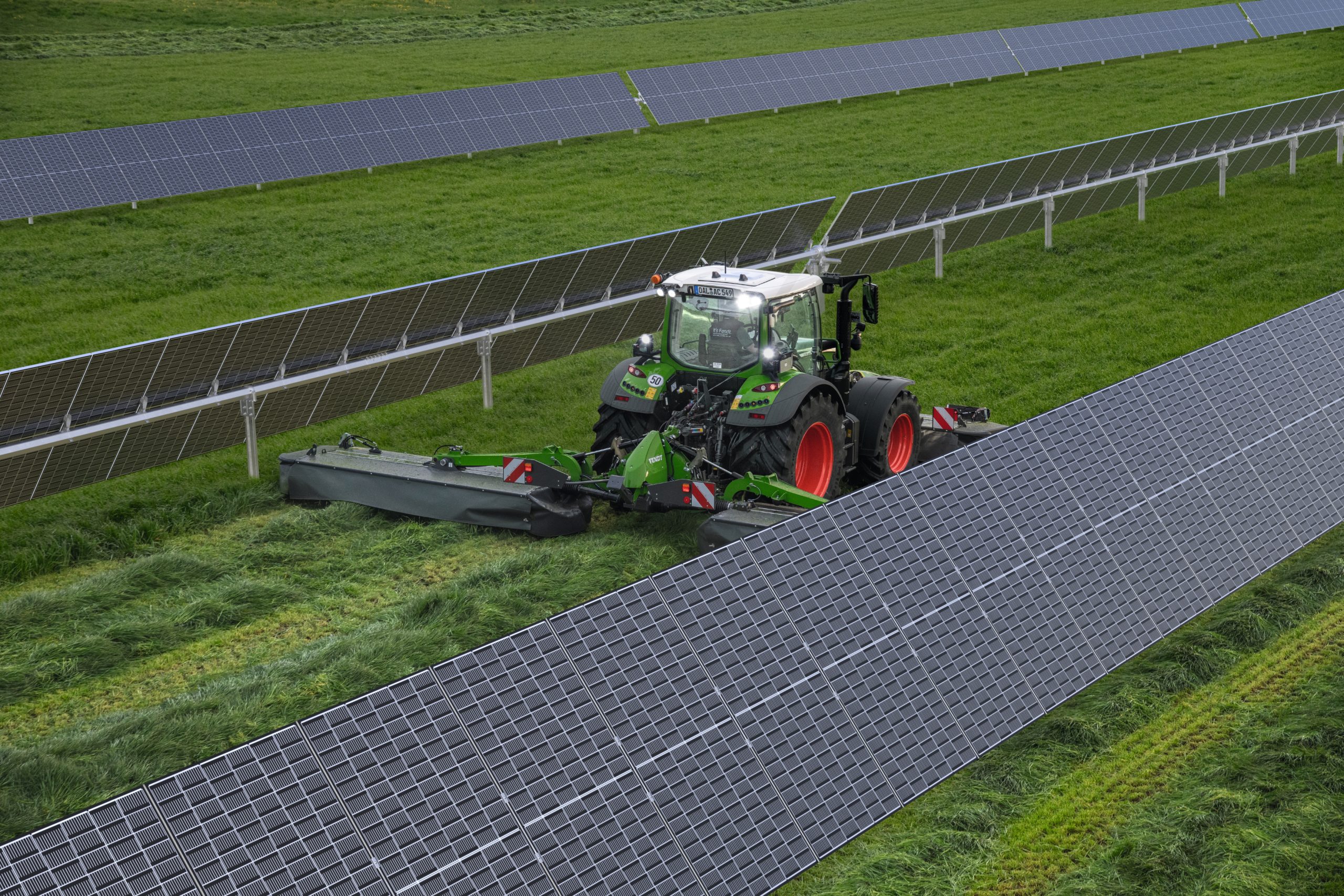 tractor in field with solar panels